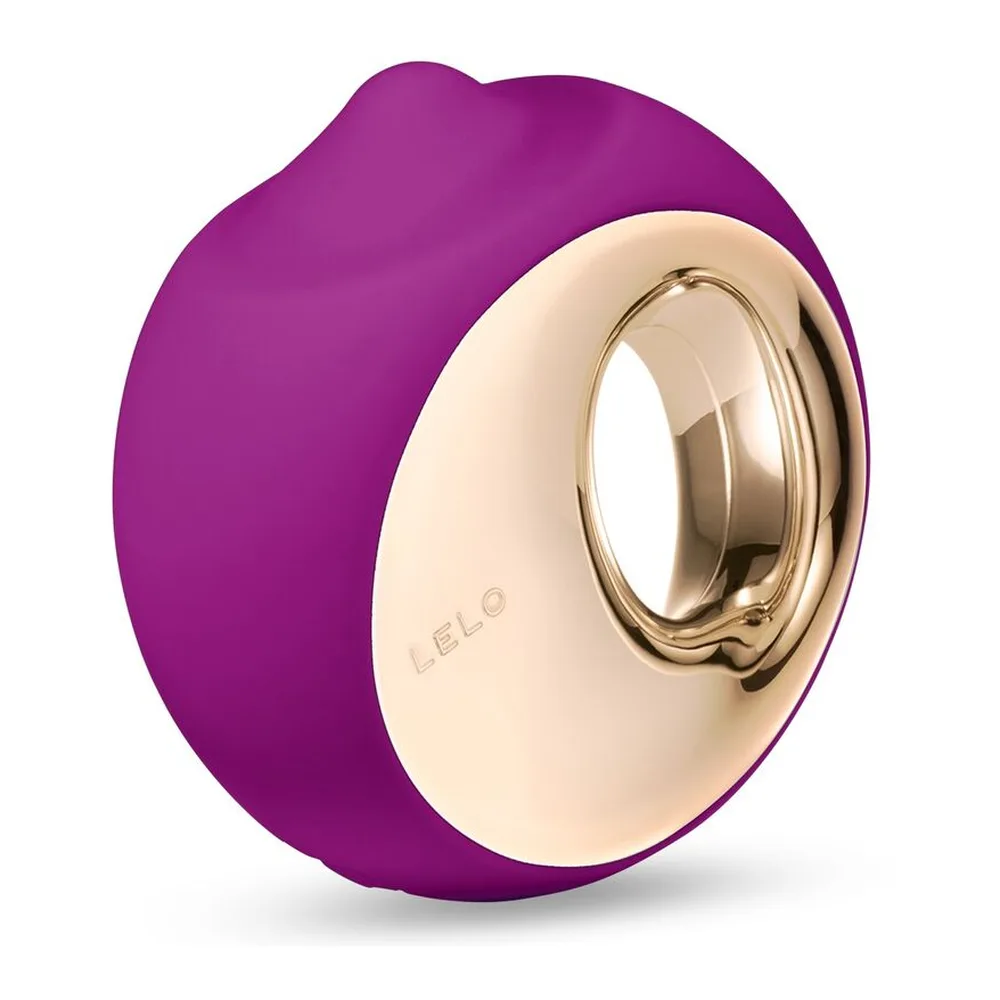 Stimulateur clitoridien Ora 3 en silicone turquoise et blanc crème avec anneau métallique doré, formes arrondies et organiques