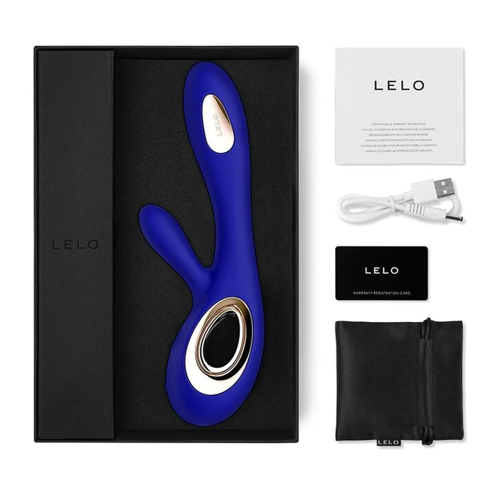 Vibromasseur rabbit en silicone bleu nuit avec tige incurvée et bras de stimulation, détails doré brossé, fond blanc