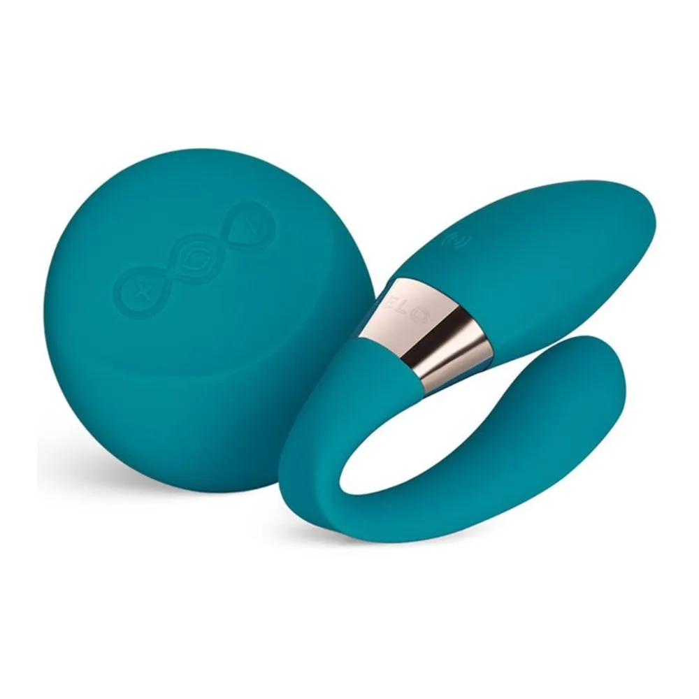 Stimulateur clitoridien noir en silicone avec deux embouts courbes, l'un pointu et l'autre arrondi, séparés par une bande dorée, sur fond blanc
