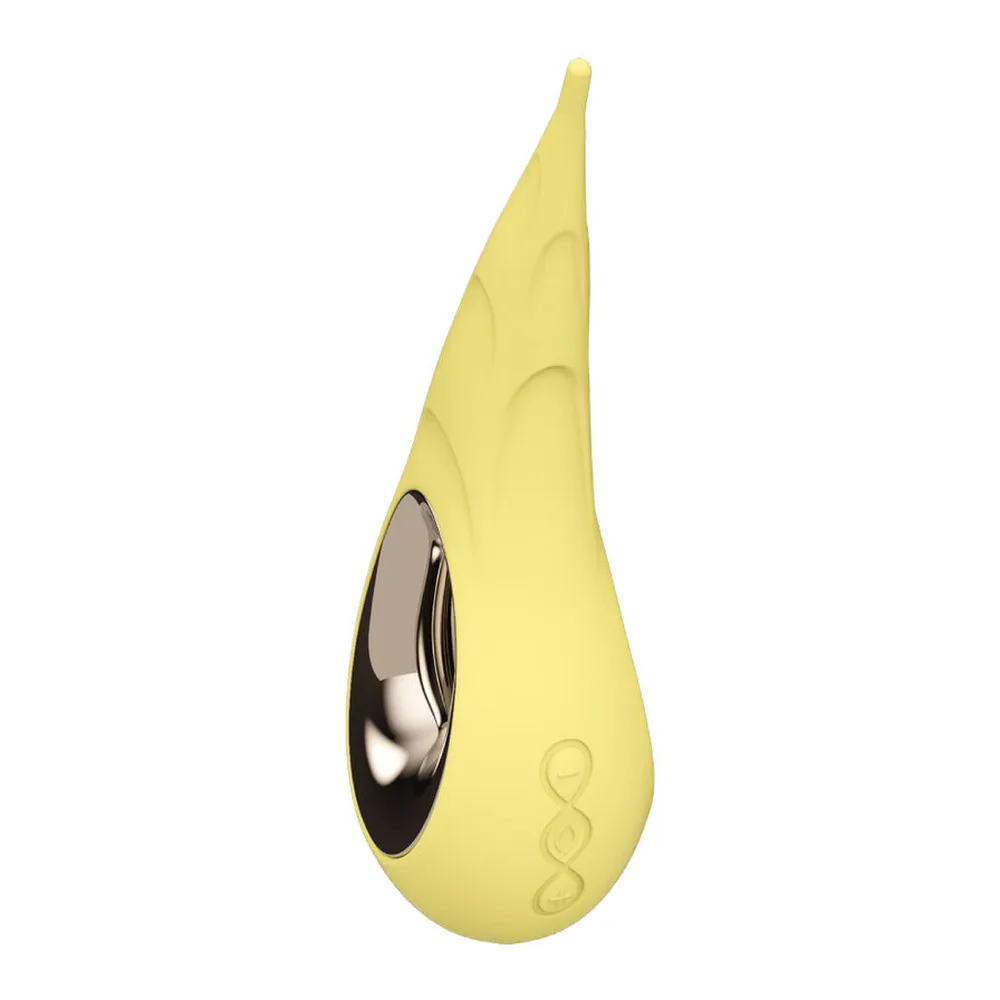 Stimulateur clitoridien en silicone jaune pâle, forme allongée pointue, embout noir métallisé, motifs gravés en relief, fond blanc