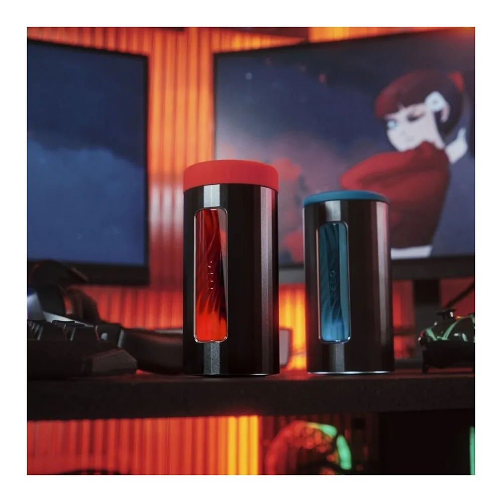 Emballage ouvert du masturbateur F1s V3 XL noir avec insert bleu, accompagné du livret LELO, du câble USB blanc et de la carte de garantie