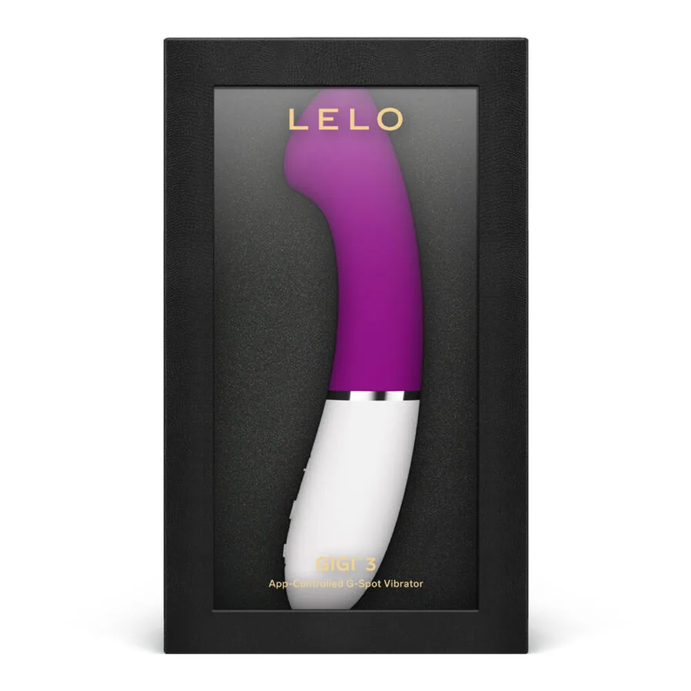 Vibromasseur point G au design ergonomique avec extrémité plate biseautée en silicone violet et manche blanc texturé, sur fond blanc