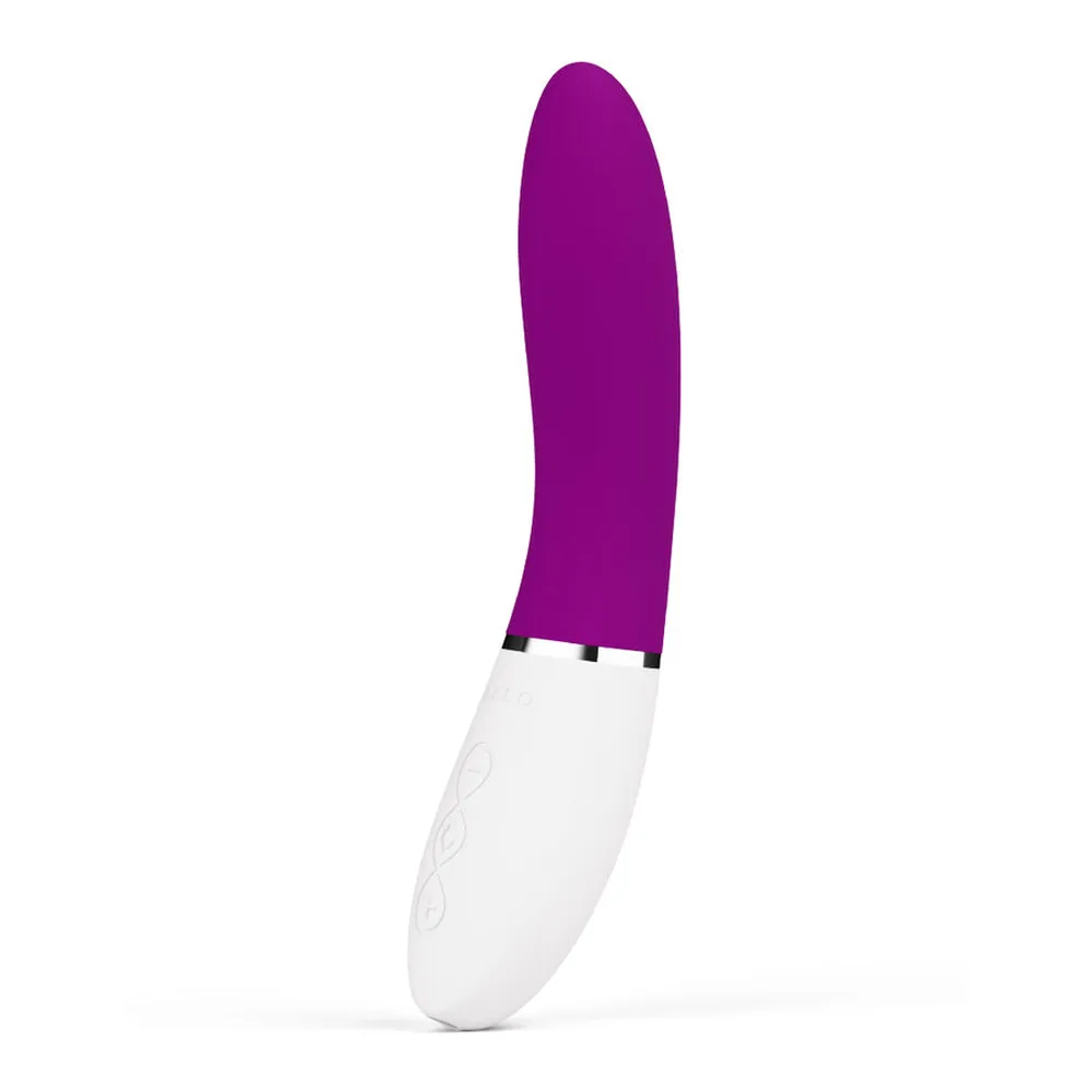 Vibromasseur point G avec corps bombé en silicone violet et poignée blanche striée, sur fond blanc