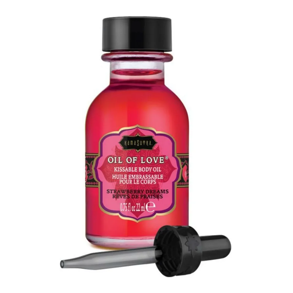 Flacon rouge de 22 ml d'huile embrassable aux fraises avec capuchon noir et applicateur pipette intégré, sur fond blanc