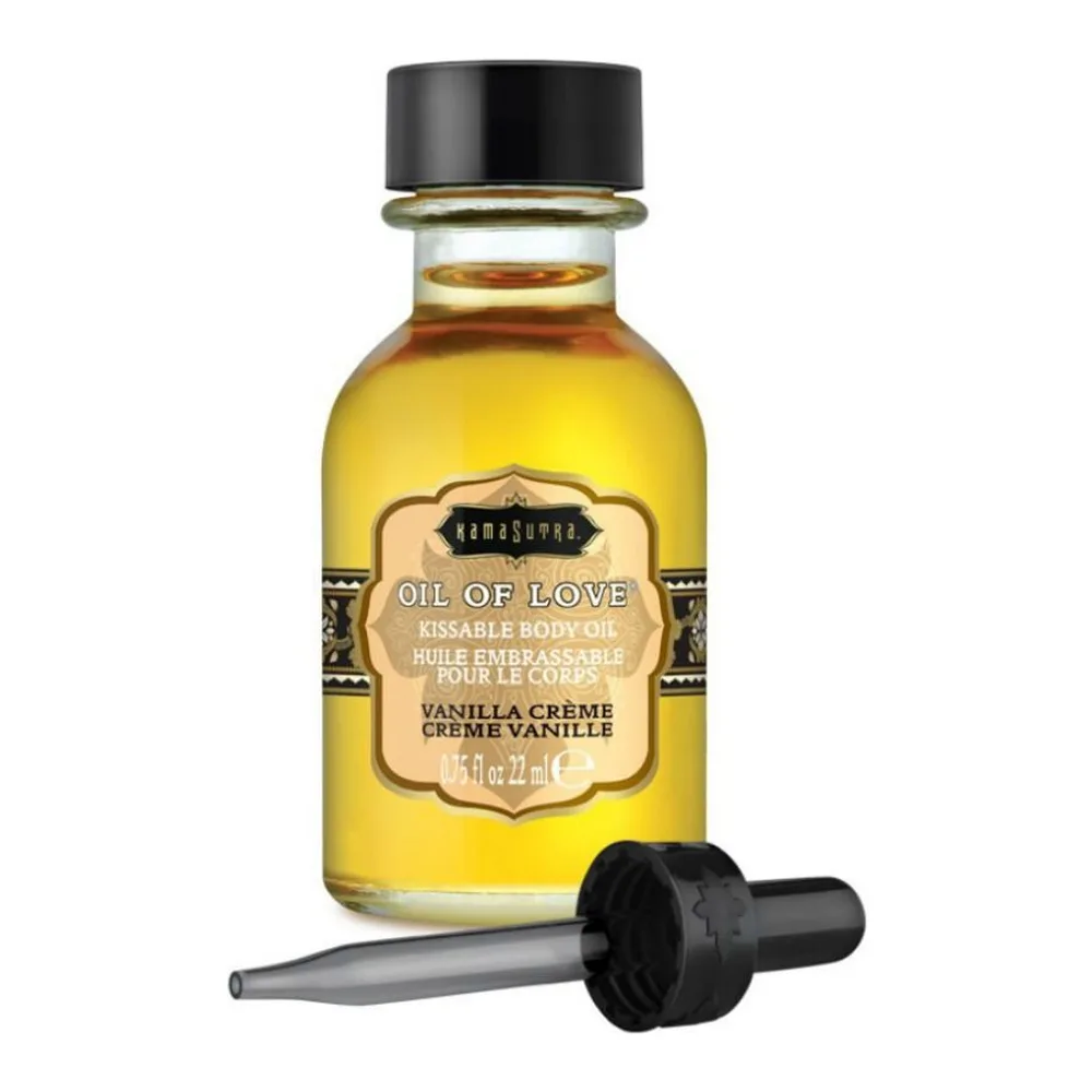 Flacon en verre de 22 ml contenant une huile jaune clair, avec bouchon noir et pipette compte-gouttes, étiquette beige ornementale indiquant "Oil of Love" et "Vanilla Crème"