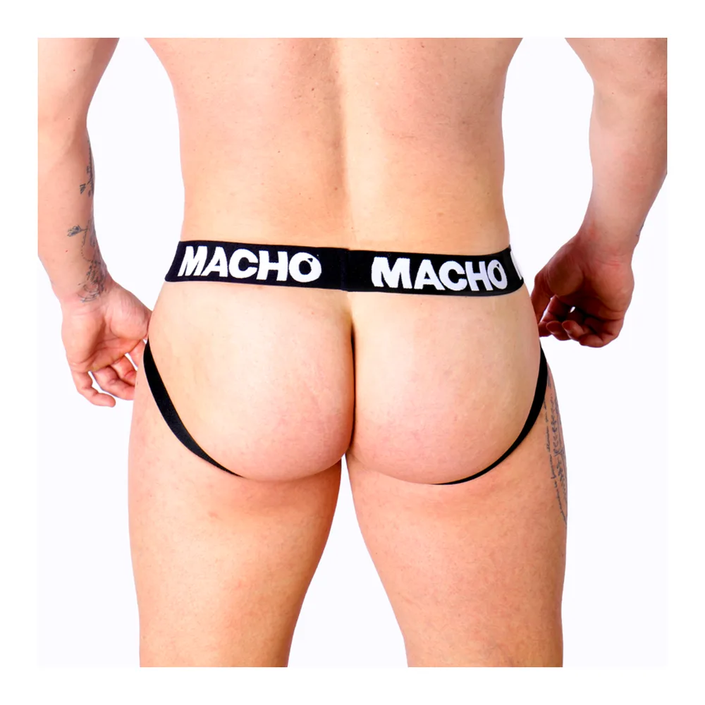 Jockstrap noir avec bande élastique blanche marquée « MACHO », porté de dos