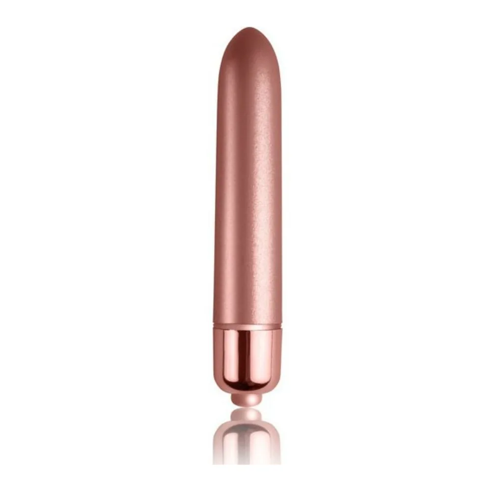 Bullet vibrant de forme allongée en finition nacrée rose, avec embout arrondi et base métallique cuivrée, présenté de face sur fond blanc