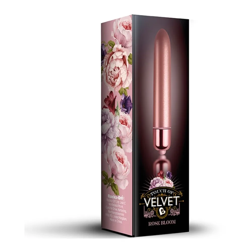 Bullet vibrant de forme allongée en finition nacrée rose, avec embout arrondi et base métallique cuivrée, présenté de face sur fond blanc