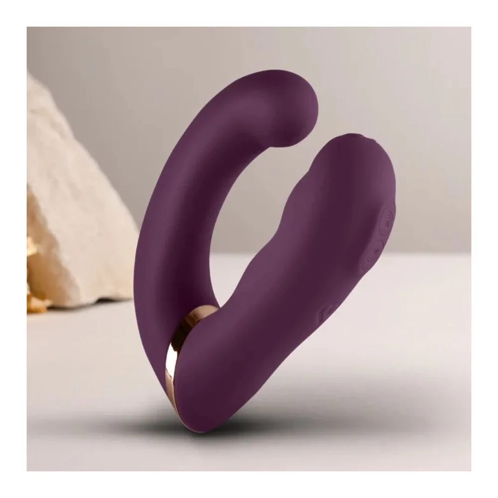 Vibromasseur double en silicone prune avec zones de stimulation arrondies et détails dorés, sur fond blanc