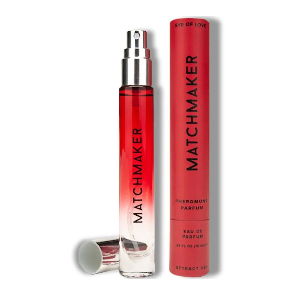 Flacon de parfum aux phéromones Matchmaker rouge de 10 ml avec bouchon chromé, et sa boîte cylindrique rouge « Eye of Love » inscrite « Pheromoni Parfum »