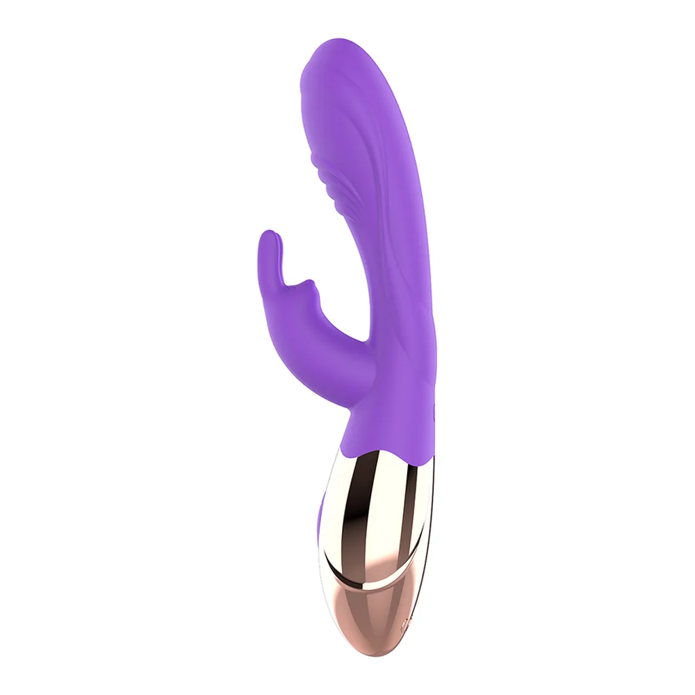 Vibromasseur en silicone violet avec deux branches articulées, l'une pointant vers le haut et l'autre recourbée vers le côté, base de charge blanche et noire visibles en bas