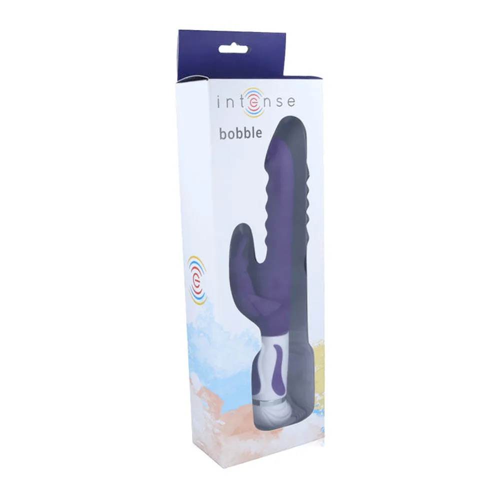 Vibromasseur en silicone violet et blanc avec tige rotative et stimulateur clitoridien en forme de lapin, fond blanc