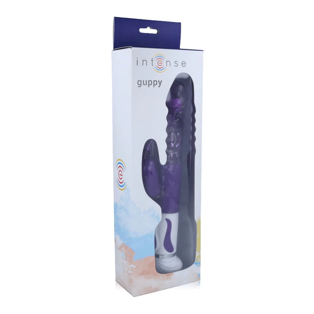 Emballage du vibrateur Guppy de la marque Intense, boîte blanche et bleue marine montrant le produit purple foncé avec tête rotative et stimulateur clitoridien