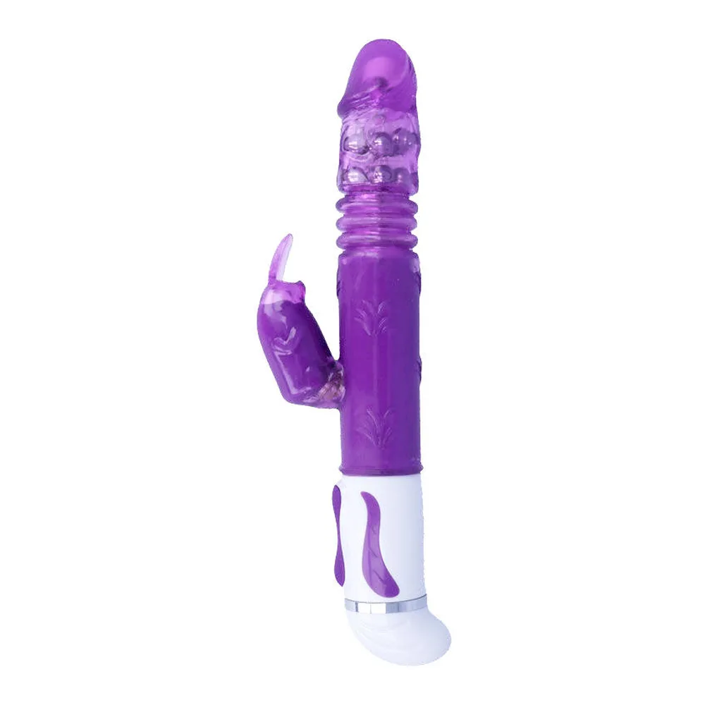 Emballage du vibrateur Estuard, boîte blanche et bleu marine affichant le produit violet avec zones texturées, pictogramme de rotation et fond paysager