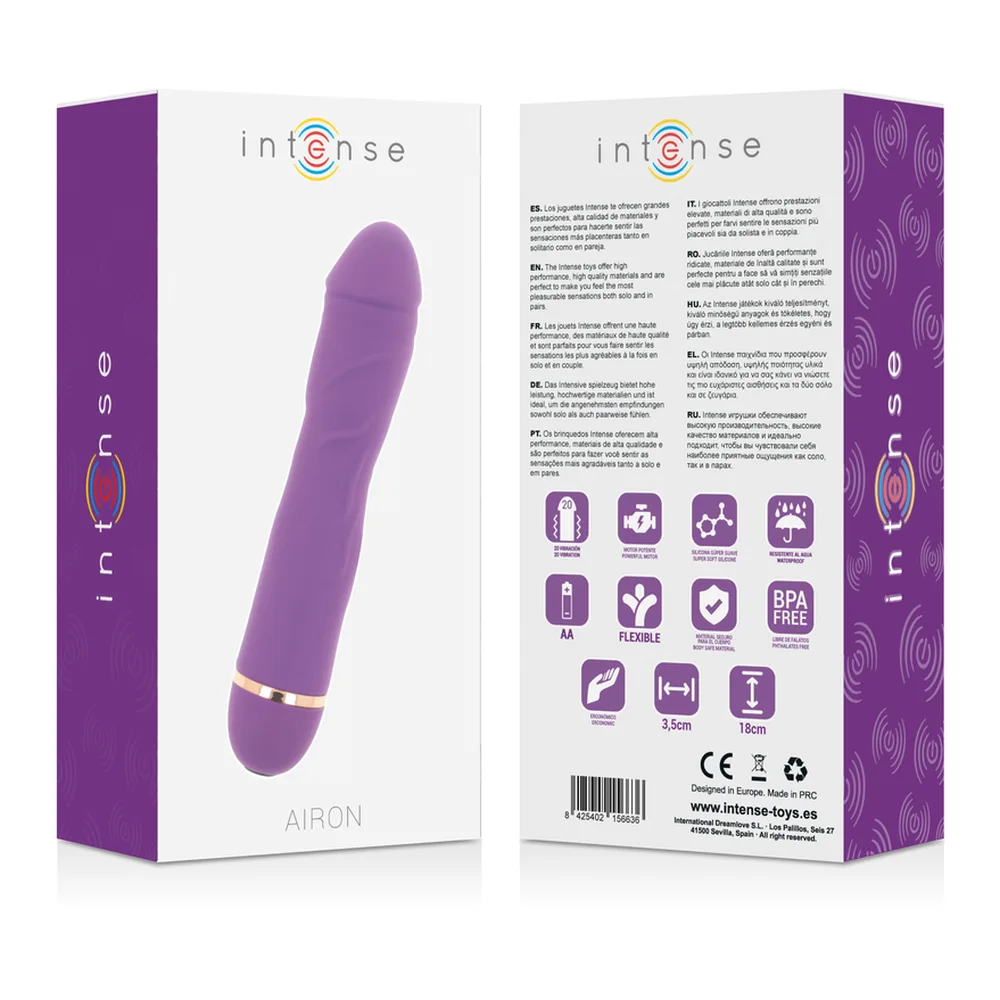 Vibromasseur rose en silicone de forme cylindrique avec extrémité arrondie, anneau doré à la base, sur fond blanc