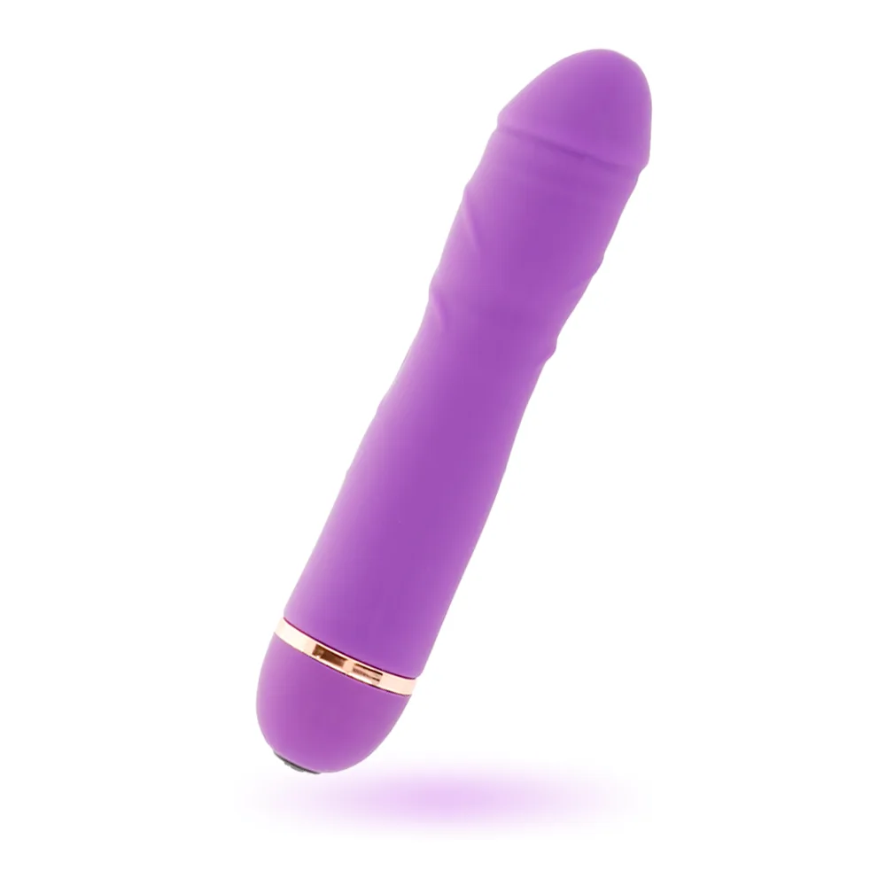 Vibromasseur rose en silicone de forme cylindrique avec extrémité arrondie, anneau doré à la base, sur fond blanc