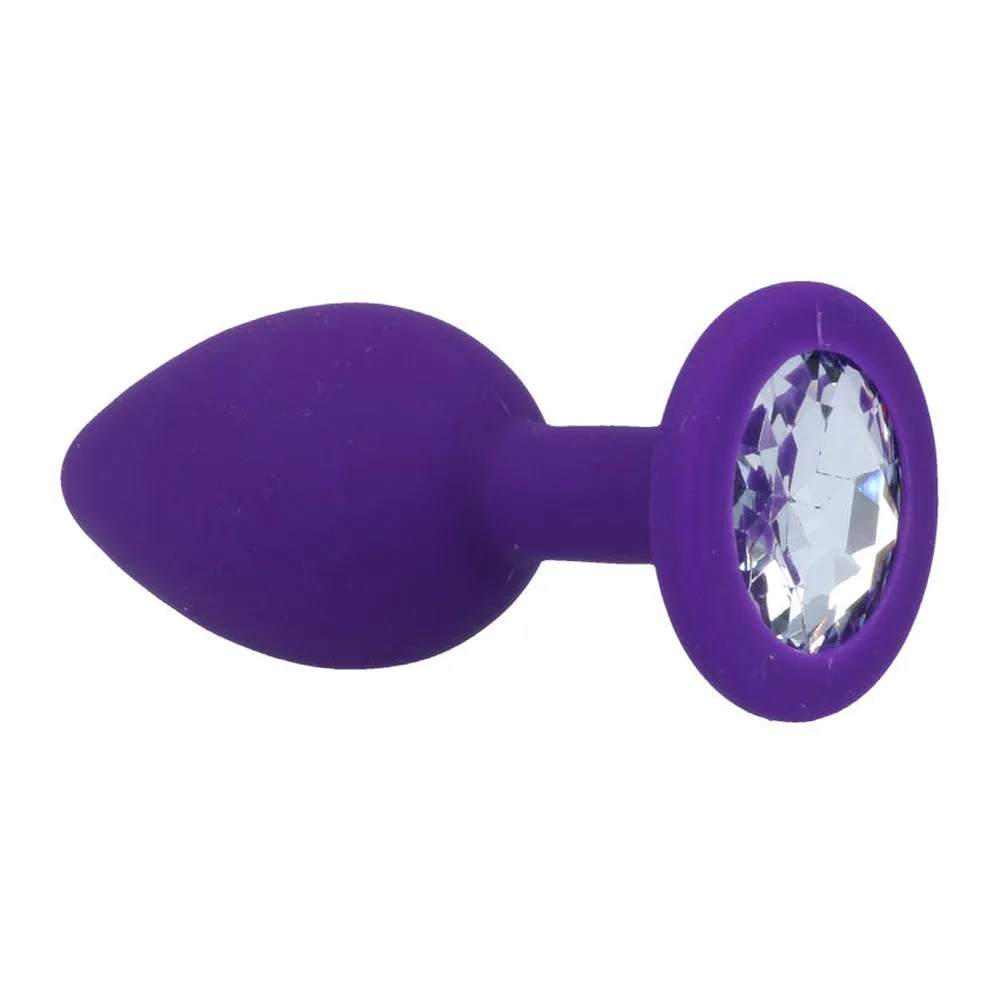 Plug anal conique en silicone rose fuchsia, base plate circulaire, sur fond blanc
