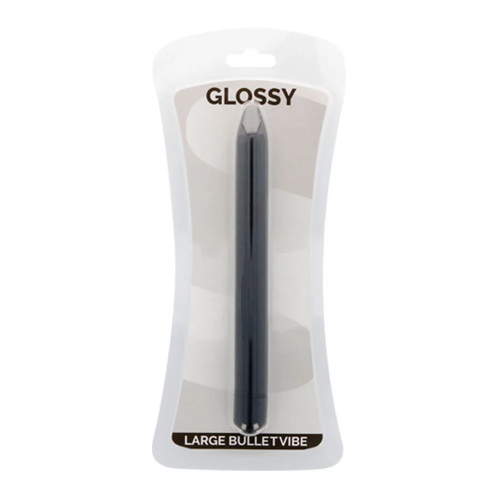 Vibromasseur rose pâle de forme allongée et effilée, corps lisse en silicone avec anneau de commande noir à la base, sur fond blanc
