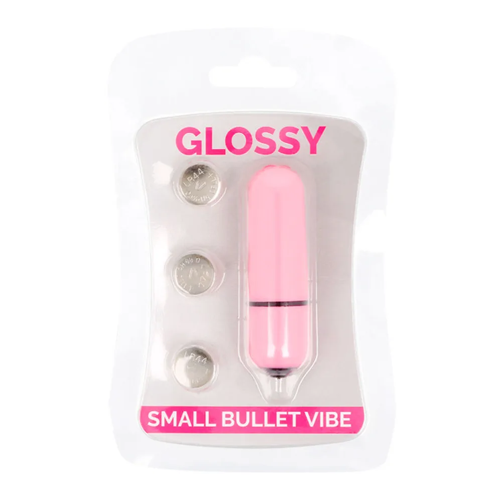 Petit vibromasseur rose pâle de forme cylindrique arrondie, divisé en deux sections par une bande noire, sur fond blanc