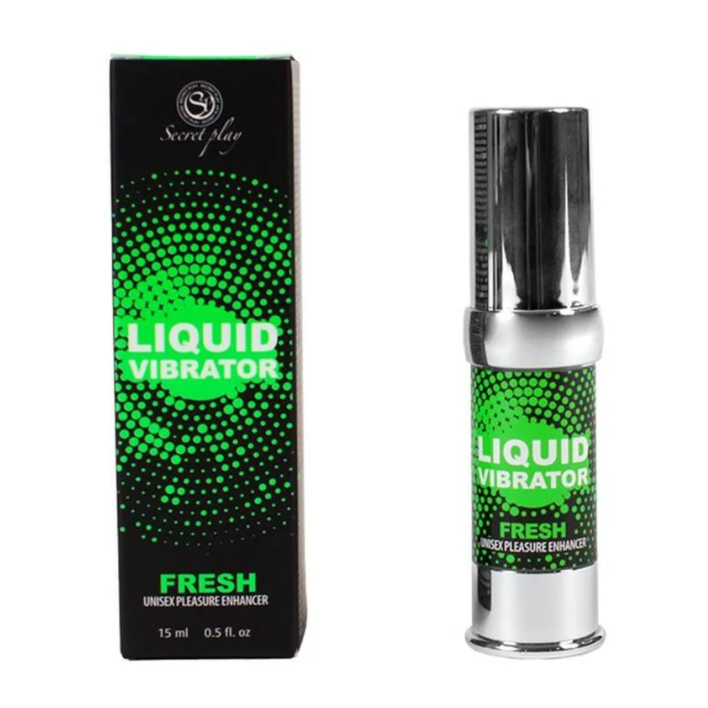 Petit flacon spray cylindrique à pompe argentée, étiquette verte fluo avec motif hexagonal, tenu en main sur fond blanc