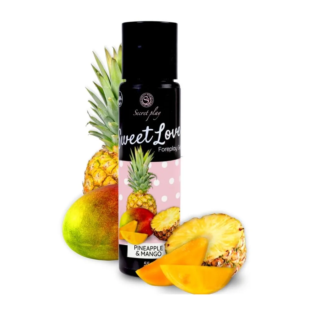 Flacon de lubrifiant comestible Sweet Love mangue-ananas avec capuchon noir, présenté entouré de fruits frais : ananas, mangue et poire sur fond blanc