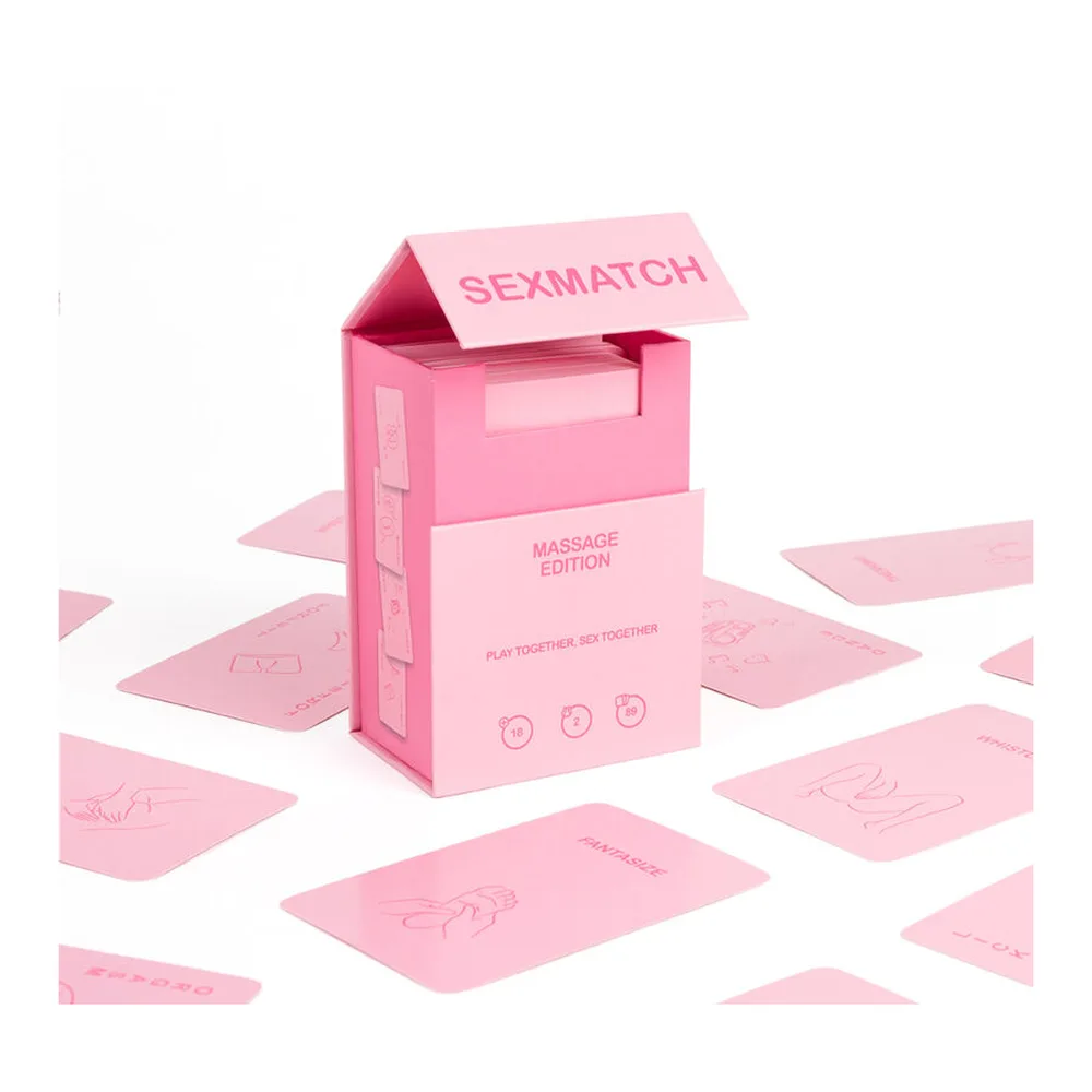 Boîte rose Sexmatch Édition Massage avec cartes de jeu empilées à côté, présentant l'emballage du produit sur fond blanc