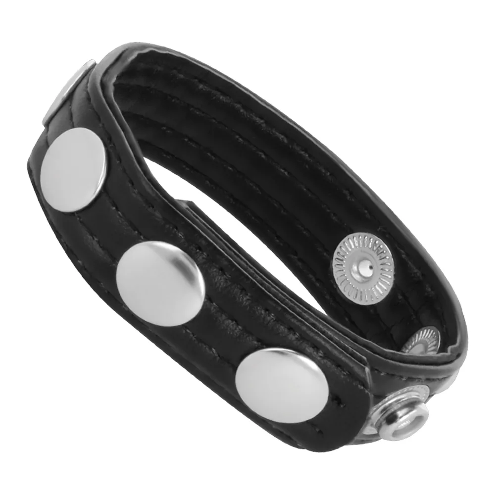 Emballage et cockring en cuir noir avec cinq boutons-pression blancs et détails en métal argenté, ajustable par pression