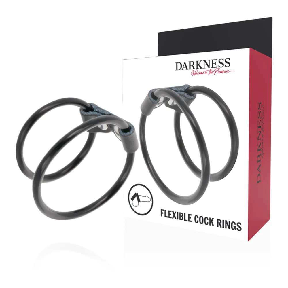 Emballage et produit de l'anneau pénis double flexible Darkness, deux boucles noires en silicone reliées par une articulation métallique, sur fond blanc