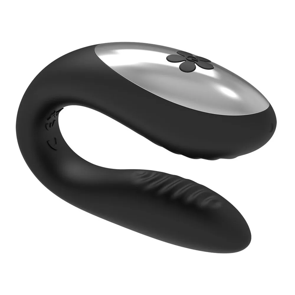 Jouet de couple en silicone noir avec sommet gris argenté, forme évasée avec base large, conçu pour la télécommande, sur fond blanc