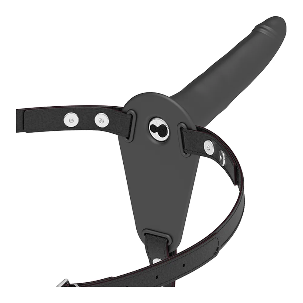 Harnais de strap-on en silicone noir avec vibrateur et bras articulés, présenté avec son emballage Fetish Submissive sur fond blanc