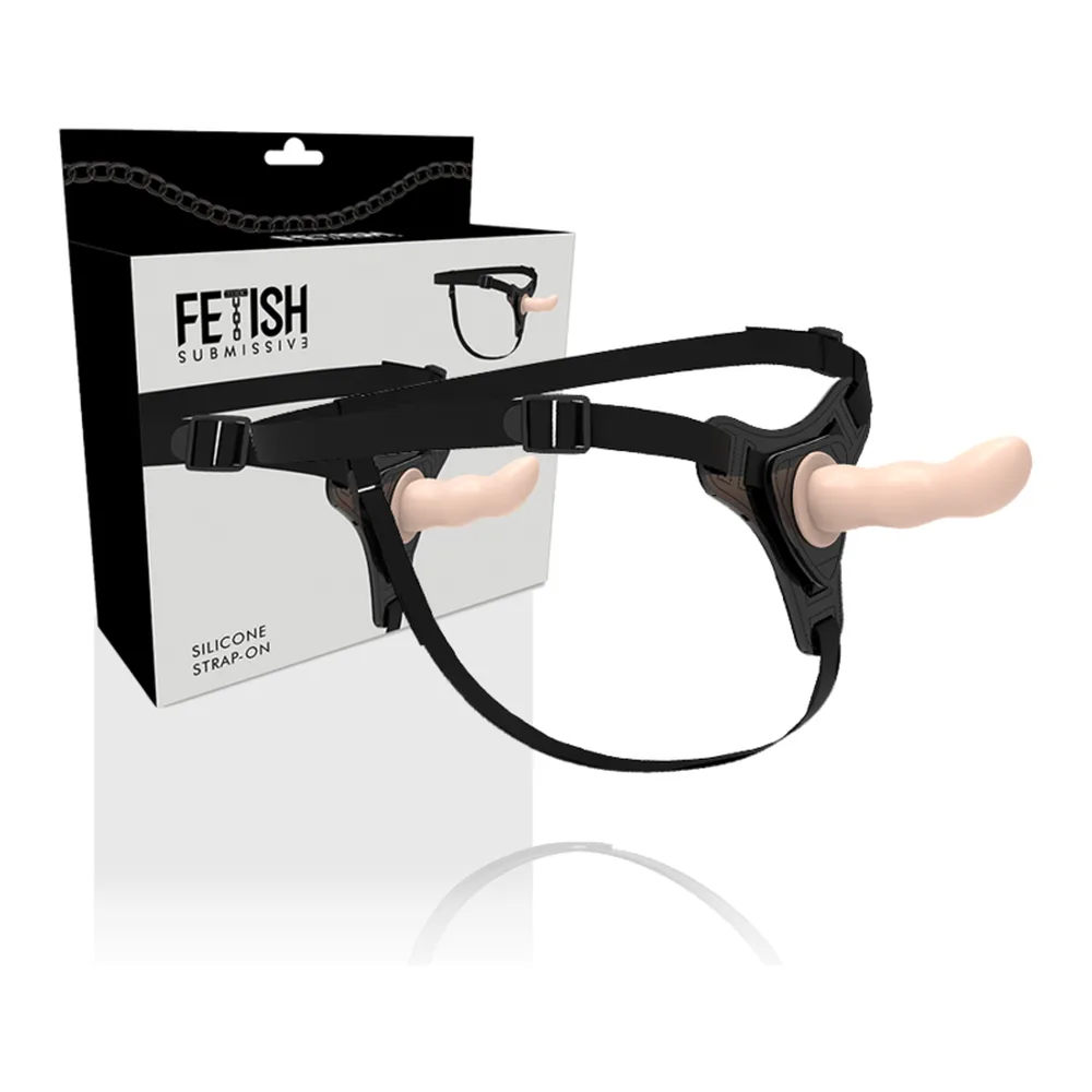 Emballage et harnais noir Fetish Submission avec gode silicone courbé et sangle ajustable, vue de face sur fond blanc