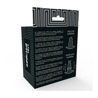 Emballage noir et blanc d'un dilatateur anal de taille moyenne, avec motifs géométriques, descriptions multilingues et pictogrammes montrant la forme du produit