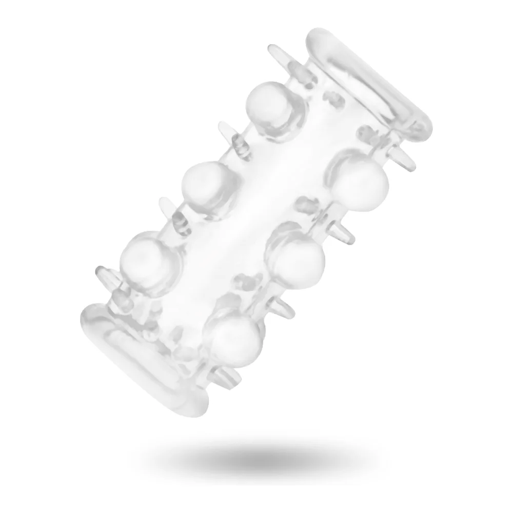 Manchon pénis transparent en silicone avec anneaux superposés hérissés de perles saillantes et anneau de retrait à l'extrémité
