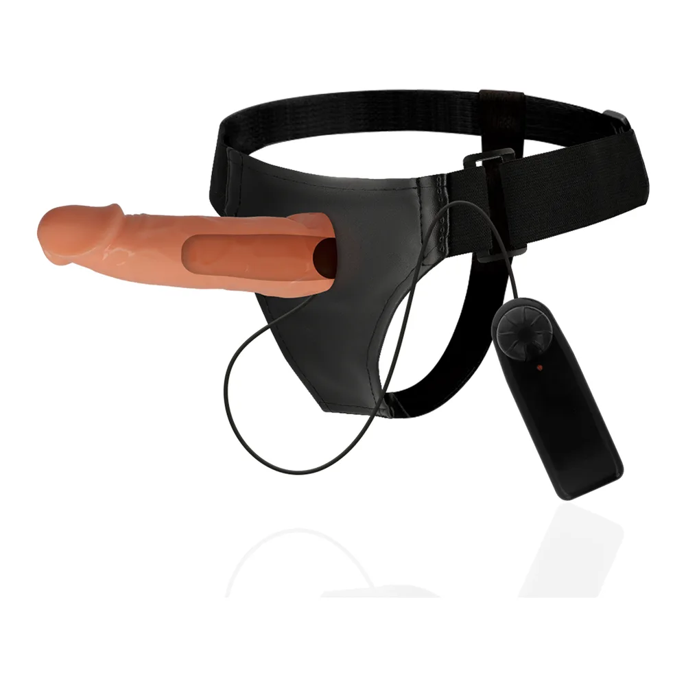 Gode-ceinture noir avec harnais ajustable en néoprène, élément creux chair de 17 cm, boucles de fixation, porté sur fond blanc