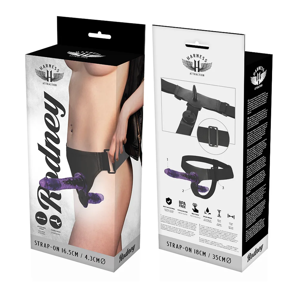 Emballage et harnais de vibromasseur double pénétration noir avec deux godes pourpres texturés, ceinture ajustable et télécommande filaire, présenté ouvert