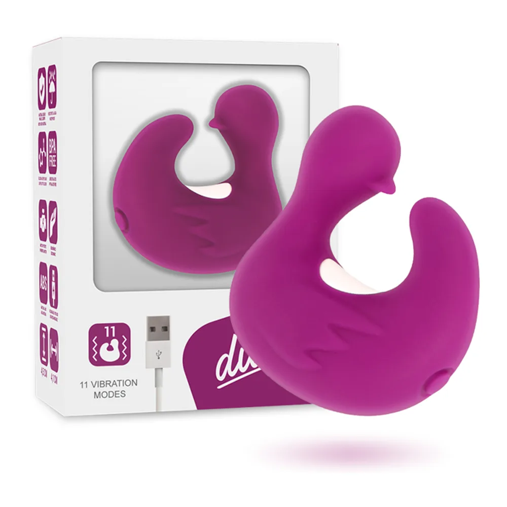 Stimulateur clitoridien en silicone violet magenta, de forme ergonomique avec ailettes courbes, présenté en boîte blanche avec câble USB de recharge et pictogrammes de modes de vibration