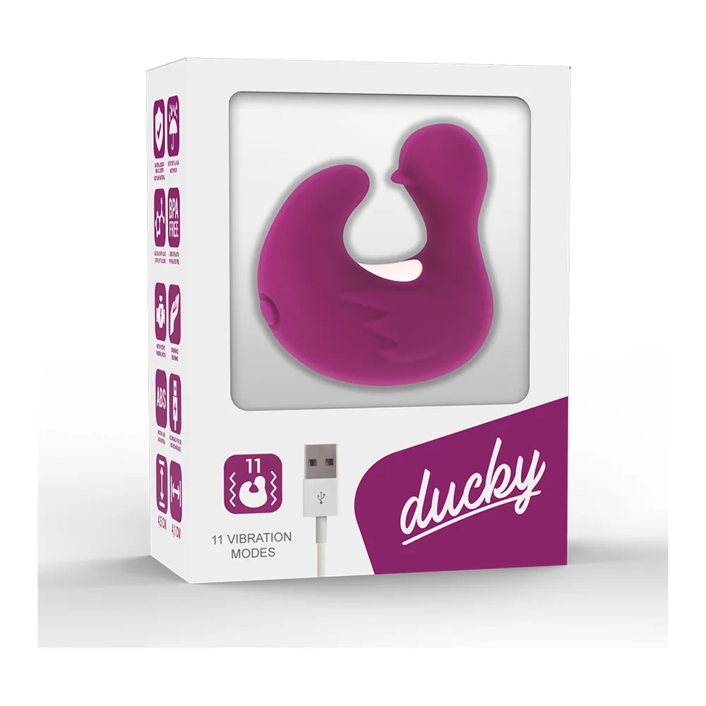 Stimulateur clitoridien en silicone violet magenta, de forme ergonomique avec ailettes courbes, présenté en boîte blanche avec câble USB de recharge et pictogrammes de modes de vibration