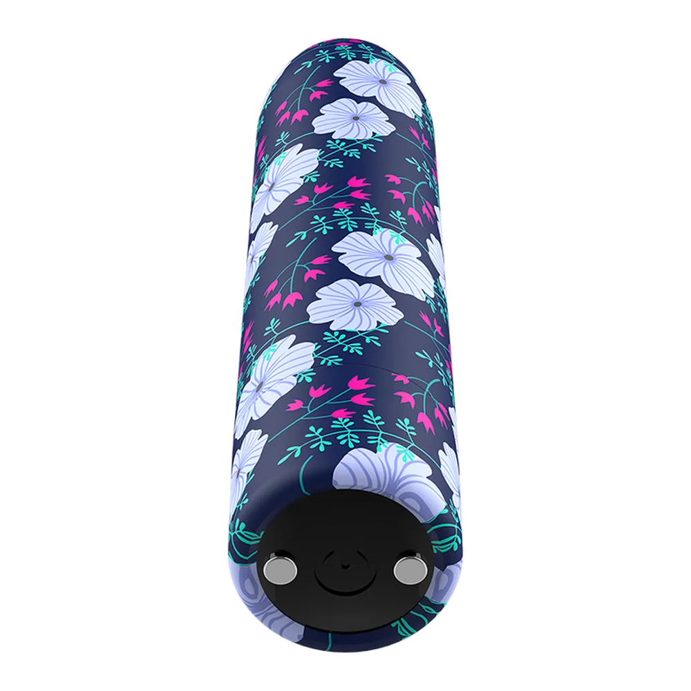 Stimulateur clitoridien rechargeable en silicone, motif floral avec fleurs blanches et feuillages roses et verts sur fond bleu marine, forme allongée à pointe arrondie