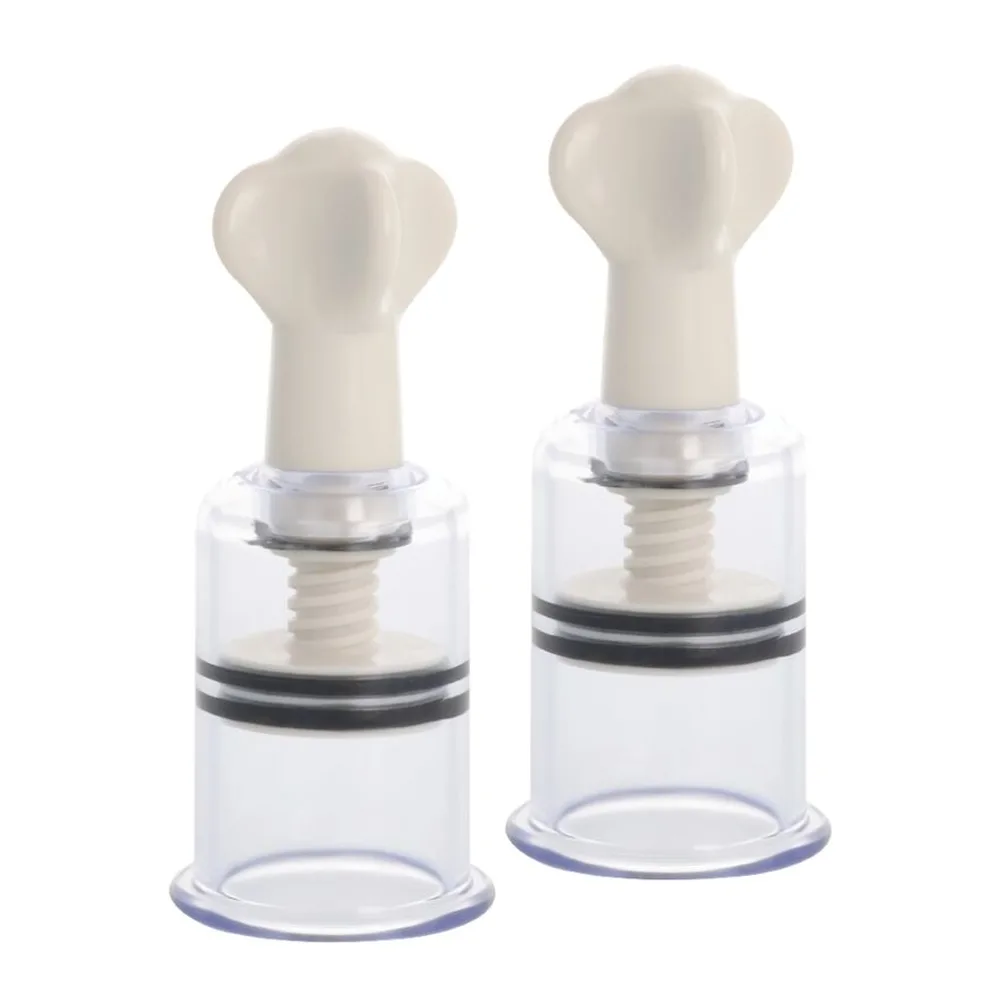 Deux stimulateurs clitoridiens manuels en silicone blanc et cylindre transparent avec ventouse, système à pompage manuel sans pile