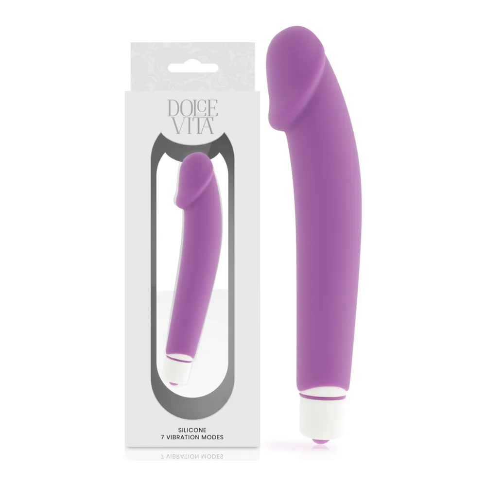Vibromasseur en silicone rose vif avec fût incurvé lisse, embout arrondi, anneau blanc à la base, présenté avec son emballage blanc de la marque Dolce Vita indiquant 7 modes de vibration