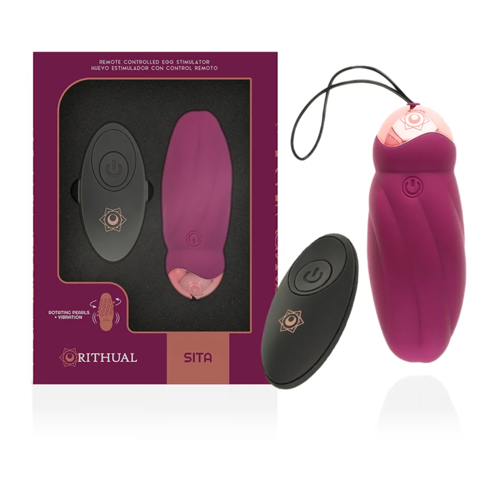 Œuf vibrant en silicone rose foncé avec perles rotatives internes, télécommande sans fil noire et bouton de contrôle visible sur le corps