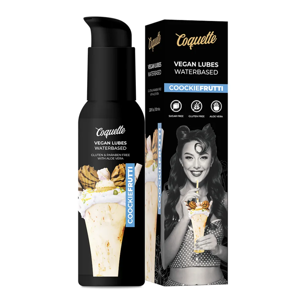 Flacon de lubrifiant vegan Coquelle à base d'eau, parfum Cookiefruit, avec pompe doseuse, présenté sur fond blanc avec illustrations de biscuits et fruits tropicaux