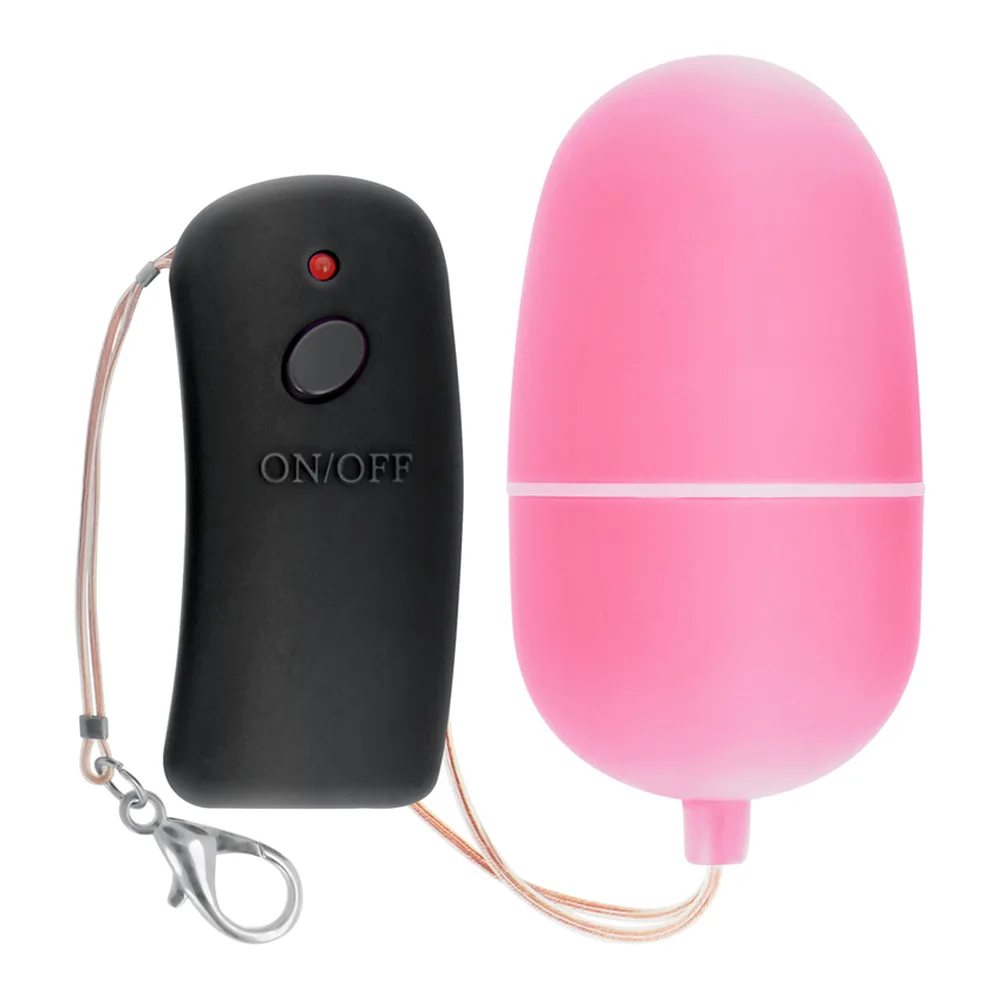 Œuf vibrant rose en silicone avec télécommande noire sans fil et cordon de transport beige, symboles de transmission affichés sur l'œuf