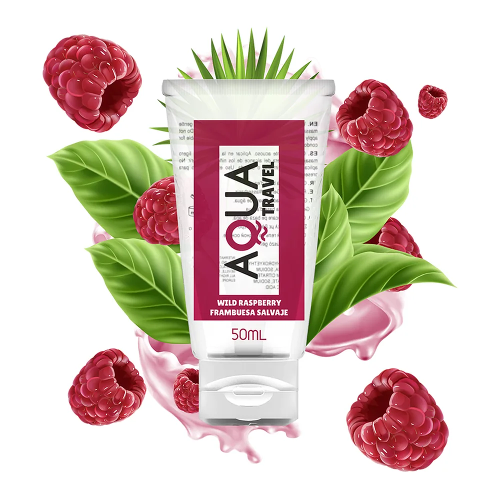 Tube blanc et rouge de lubrifiant comestible 50 mL entouré de framboises rouges fraîches et de feuilles vertes, avec éclaboussures roses