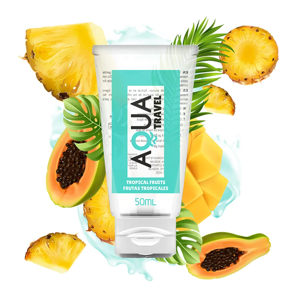 Flacon de lubrifiant aromatisé 50ml entouré d'ananas, papaye et feuillage tropical vert sur fond bleu ciel
