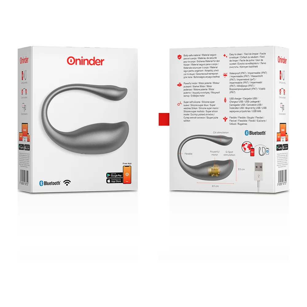 Œuf vibrant gris en silicone, forme incurvée en C avec extrémités arrondies, surface lisse et brillante, fond blanc