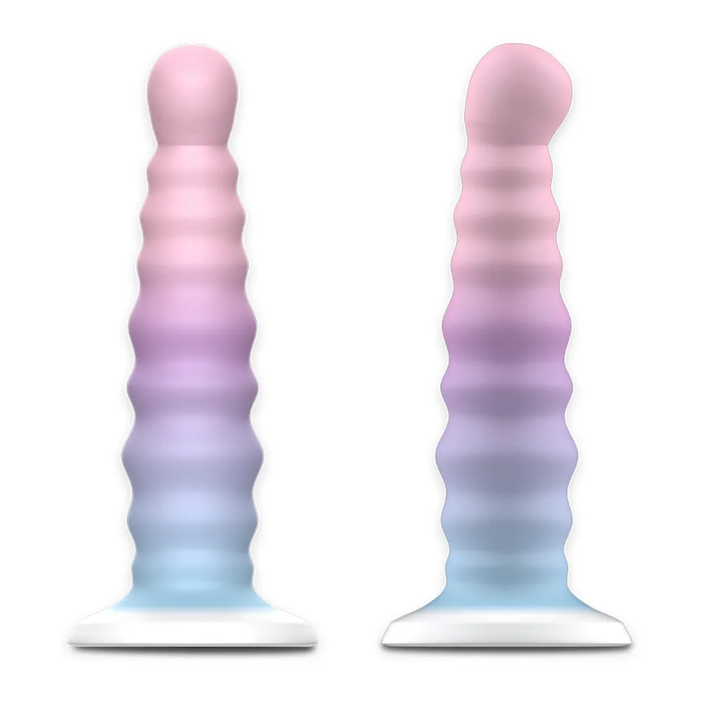 Gode Arian Nayade en silicone rose dégradé bleu, à anneaux empilés, présenté hors et dans son emballage cylindrique noir et blanc