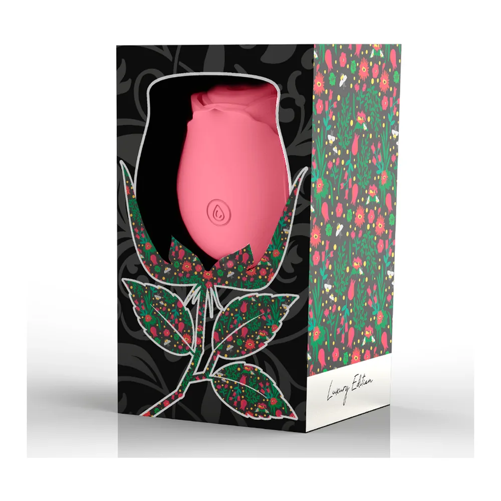 Emballage du stimulateur clitoridien Wave Clitoris Suction Édition, en forme de rose en silicone violet foncé avec feuilles imprimées rose et vert, présenté dans une boîte décorée de motifs floraux sur fond noir