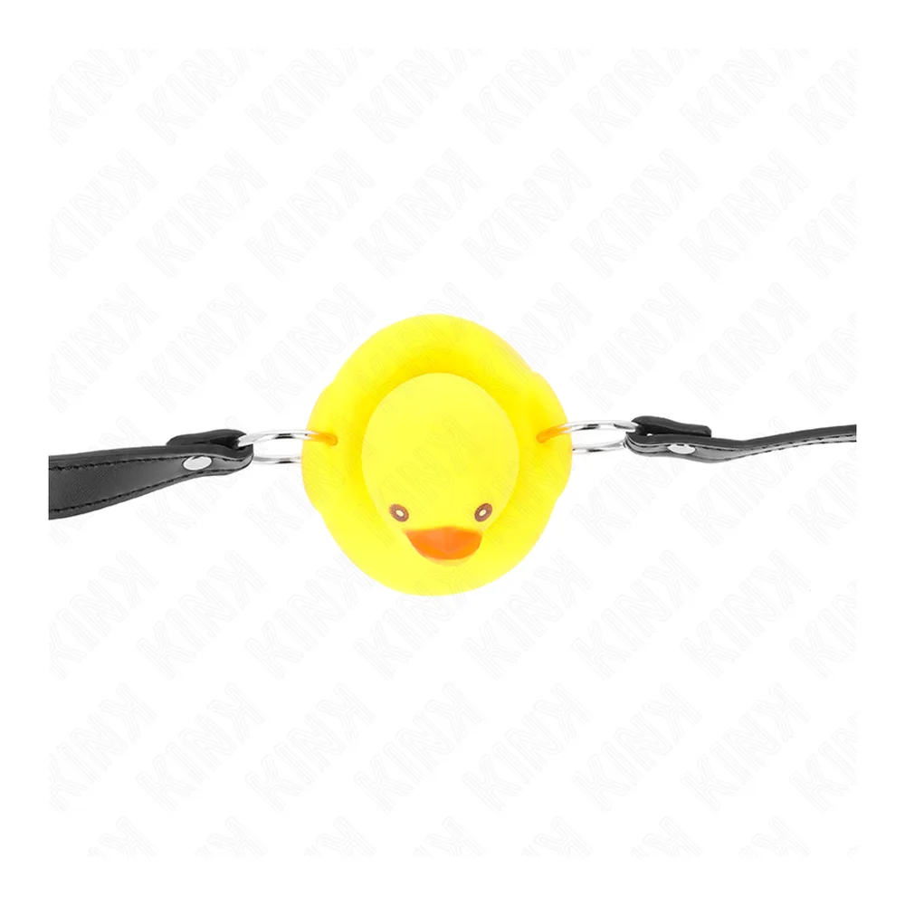 Bâillon en silicone jaune en forme de canard souriant avec bec orange, sangles noires ajustables de chaque côté, fond blanc
