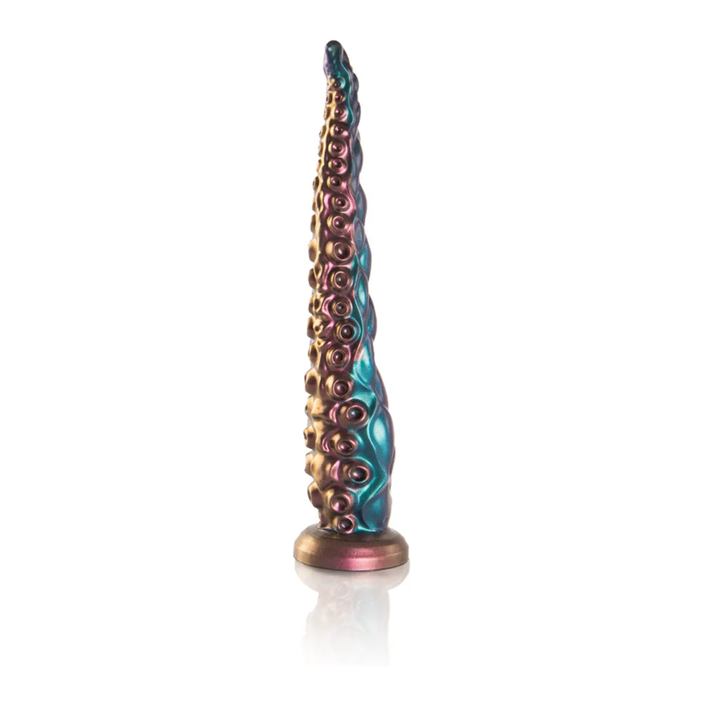 Gode tentacule effilé en silicone irisé bleu et rose, recouvert de ventouses en relief, base métallisée rose-doré, sur fond blanc